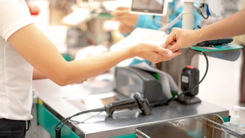 Female hand with coin money pay for goods concept. Hand giving cash and hand receiving cash, paying checkout at cashier access in supermarket.; Shutterstock ID 1739585951